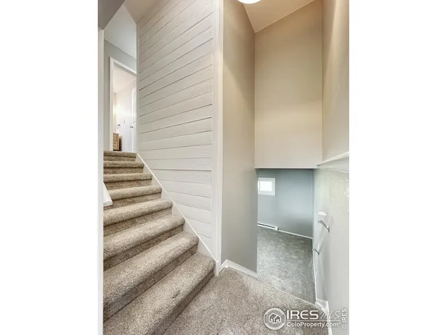 a view of a hallway with staircase