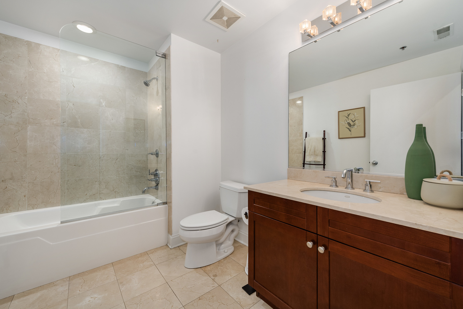 23 North Green Street, Unit 402 Chicago, IL 60607 - Photo 13 of 18 a bathroom with a double vanity sink toilet and shower