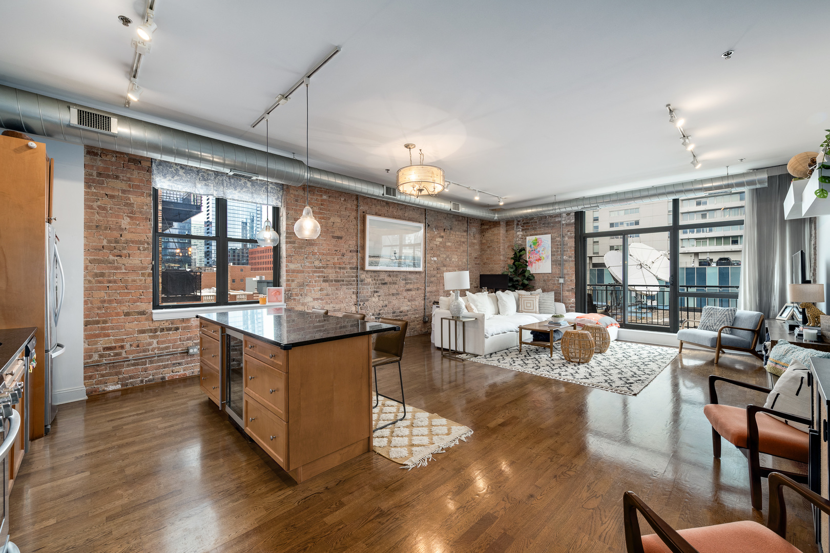 23 North Green Street, Unit 402 Chicago, IL 60607 - Photo 4 of 18 a living room with furniture large window and wooden floor