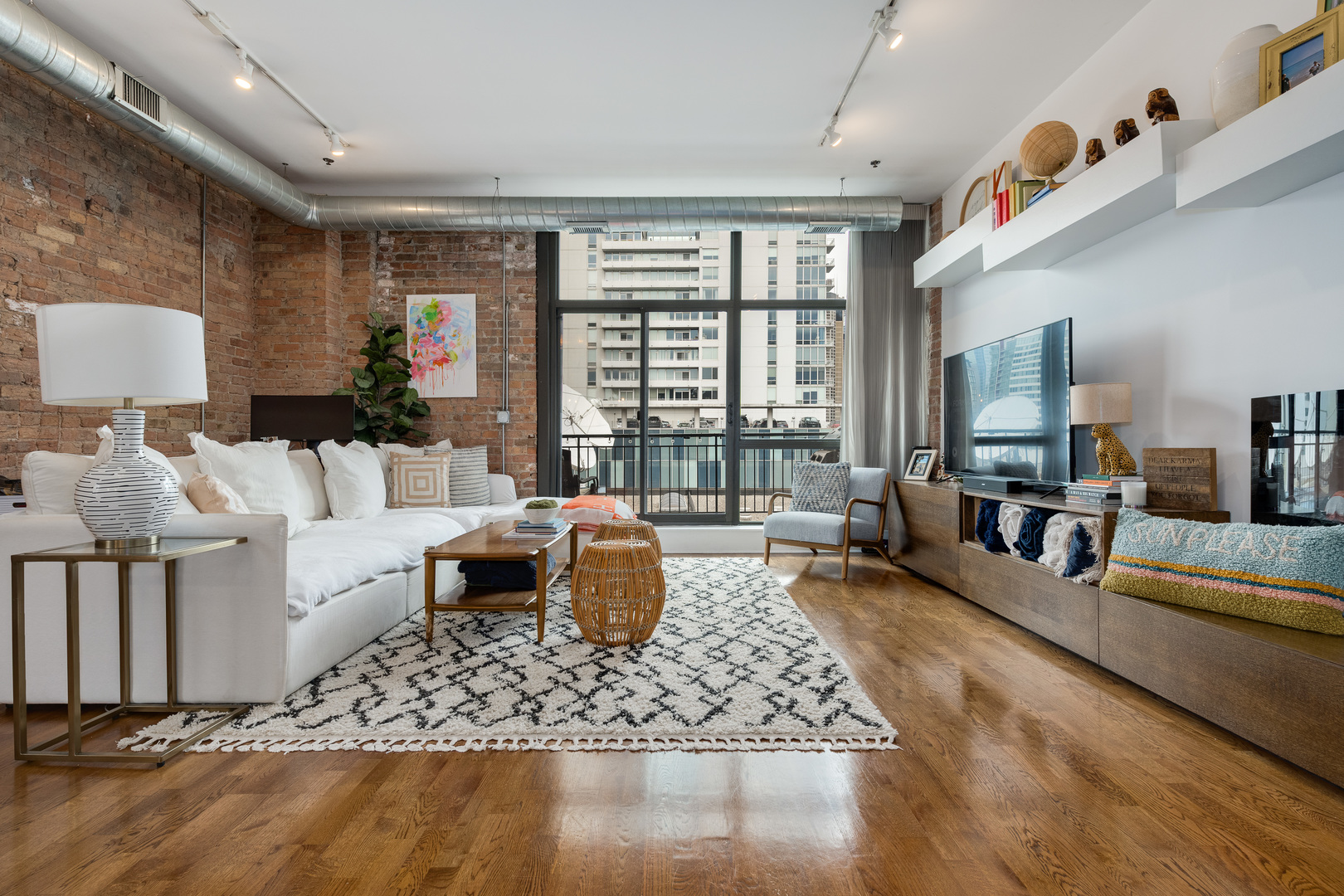 23 North Green Street, Unit 402 Chicago, IL 60607 - Photo 5 of 18 a living room with furniture and a large window