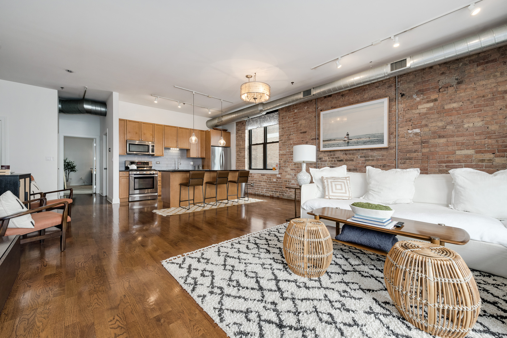 23 North Green Street, Unit 402 Chicago, IL 60607 - Photo 8 of 18 a living room with furniture and a table