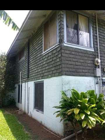 33 Kaluhea Place Haiku, HI 96708 - Photo 2 of 24 a front view of a house with a yard