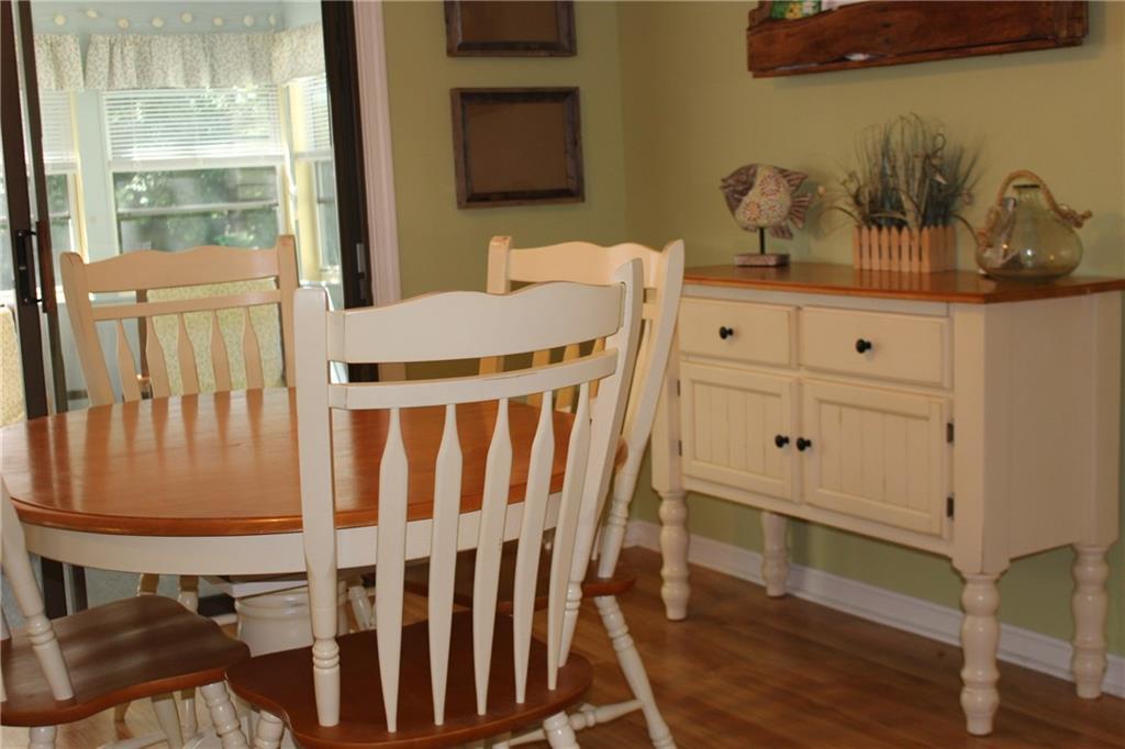 86 Flintlock Village Road, Unit 2 Wells, ME 04090 - Photo 6 of 28 The dining room overlooks the sunroom