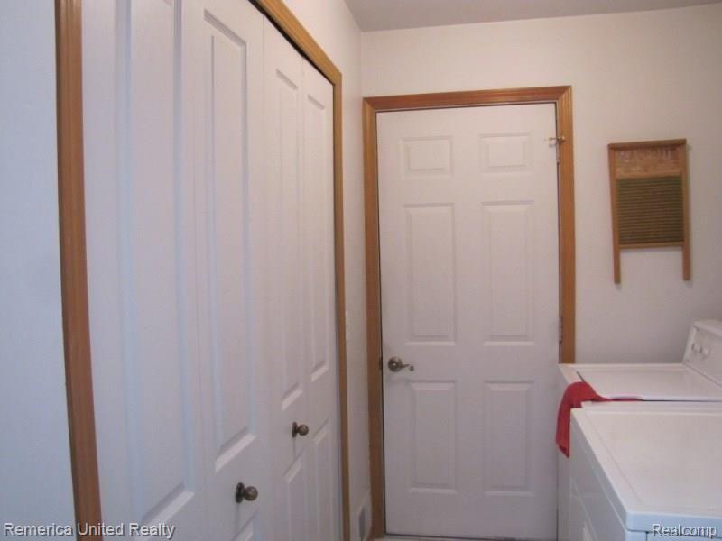 23101 Farmington Road, Unit 2 Farmington, MI 48336 - Photo 13 of 28 Front floor laundry