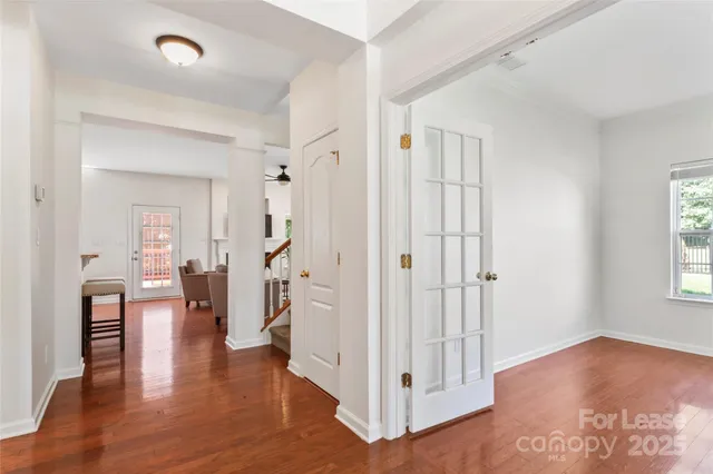 wooden floor in an empty room with a window