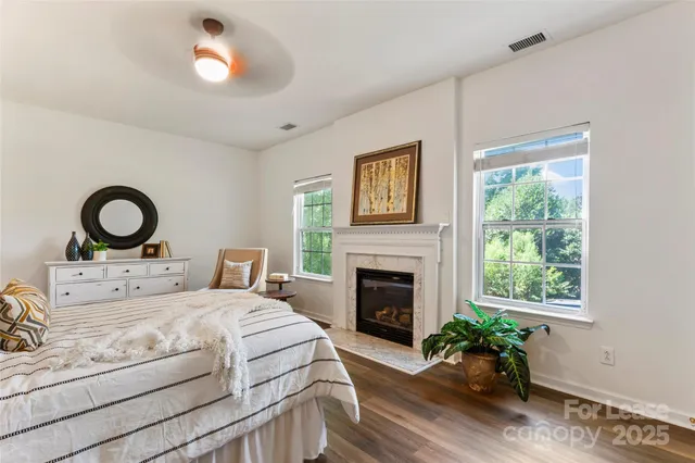 a bedroom with a bed and a fireplace