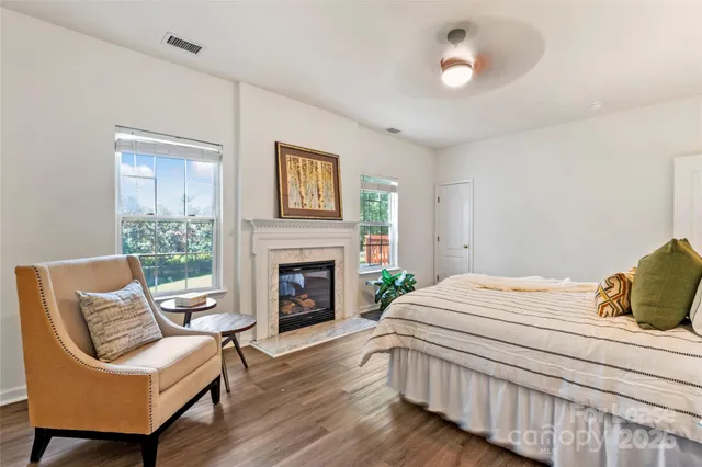 a bedroom with a bed and a chair