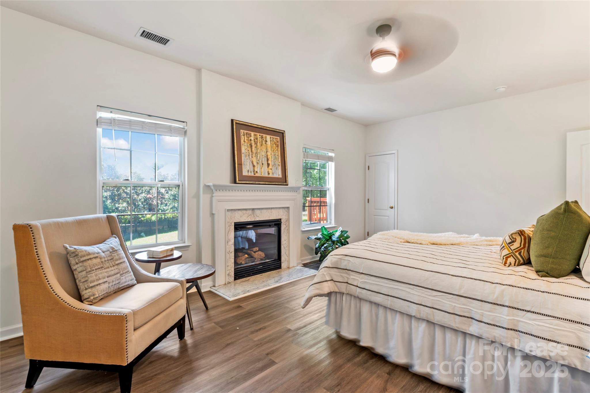 2003 Red Carpet Court Indian Trail, NC 28079 - Photo 22 of 28 a bedroom with a bed and a chair