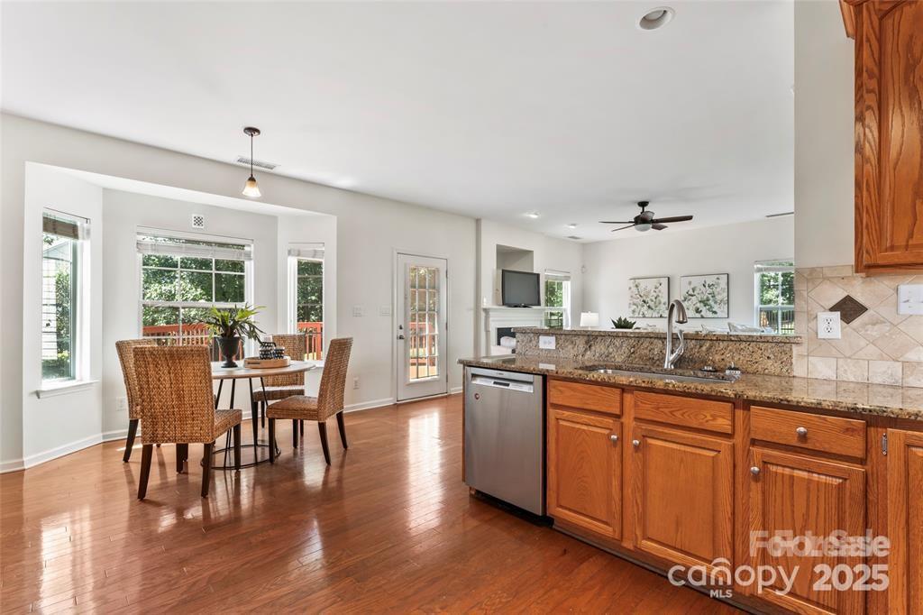2003 Red Carpet Court Indian Trail, NC 28079 - Photo 26 of 28 a kitchen with granite countertop sink dining table and chairs