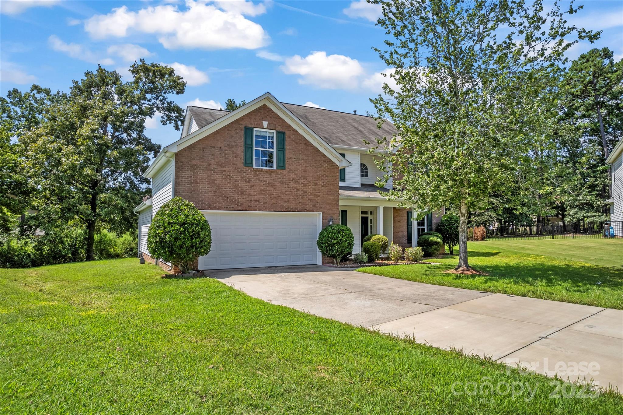 2003 Red Carpet Court Indian Trail, NC 28079 - Photo 27 of 28 a front view of a house with a yard and trees