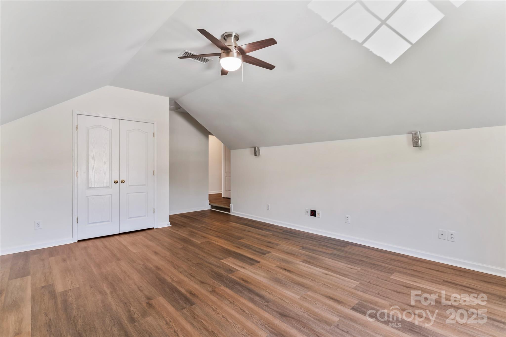 2003 Red Carpet Court Indian Trail, NC 28079 - Photo 6 of 28 a view of empty room with wooden floor and ceiling fan
