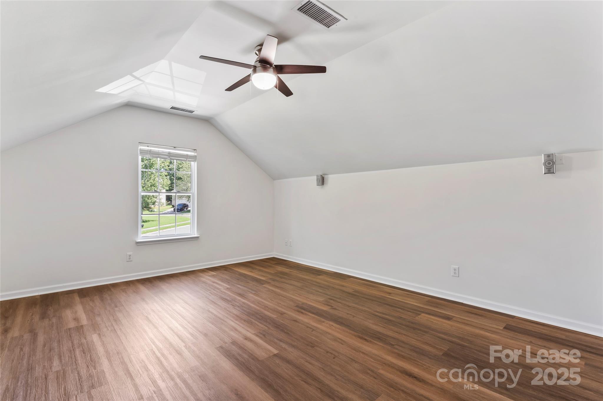 2003 Red Carpet Court Indian Trail, NC 28079 - Photo 7 of 28 wooden floor in an empty room with a window