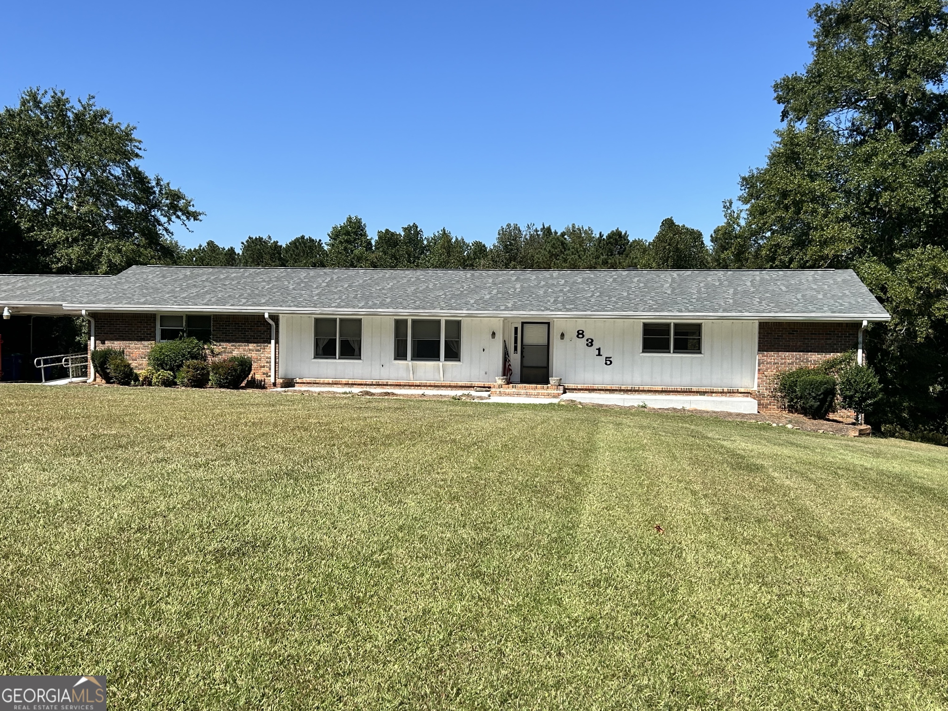 8315 Ridge Road Fairburn, GA 30213 - Photo 1 of 1 a front view of a house with a yard