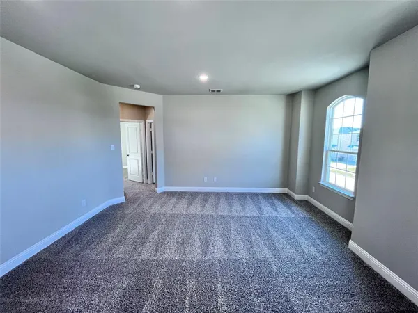 a bathroom with a glass shower door and a sink
