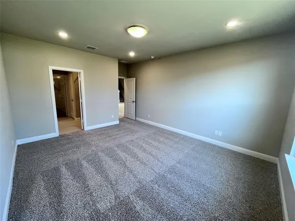 a view of empty room with windows