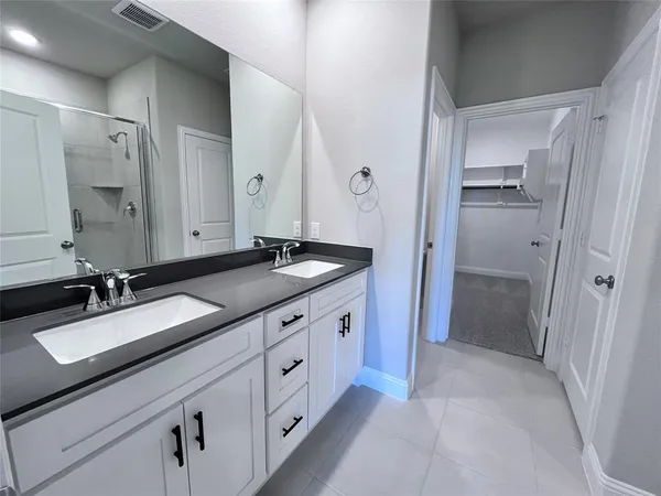 an empty room with closet and entryway