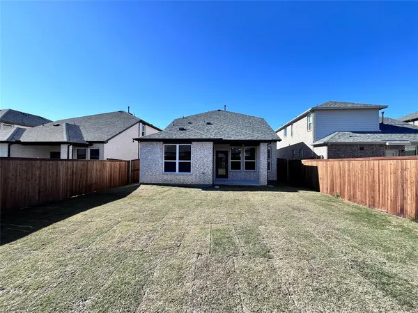 a house view with a backyard space