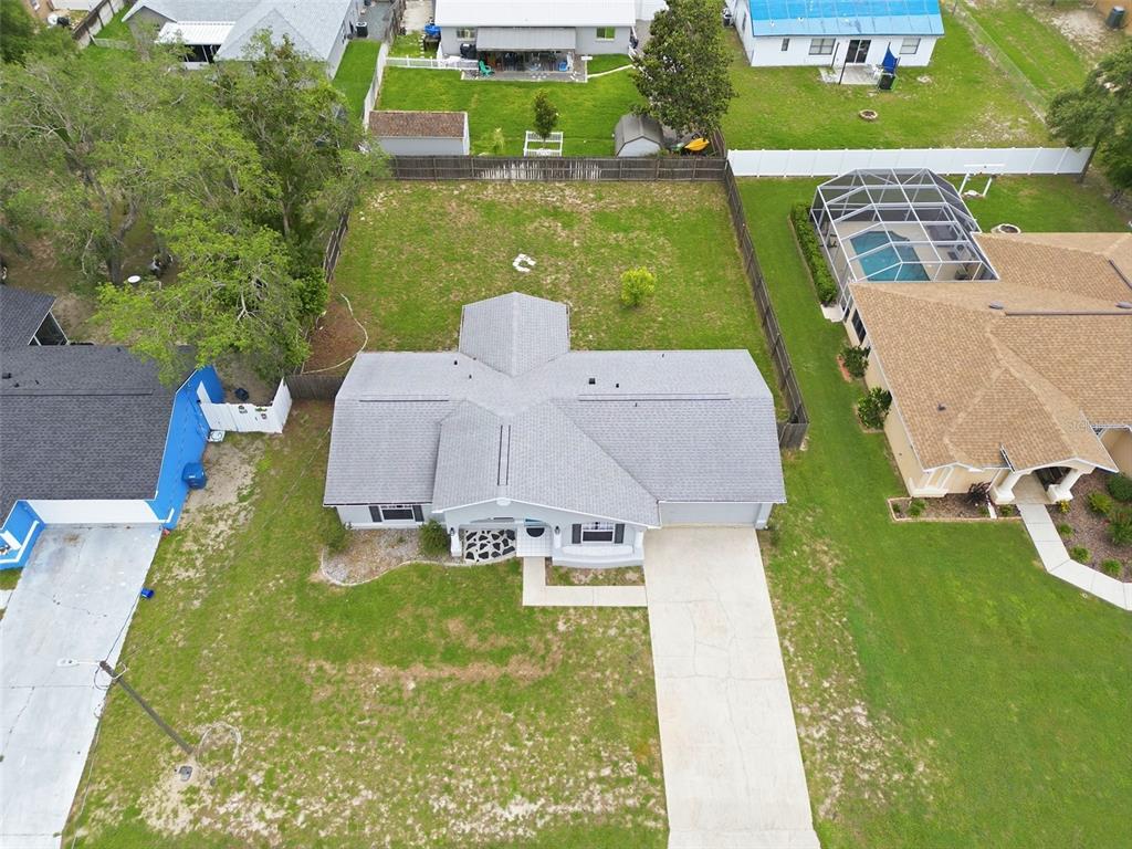 2202 Godfrey Avenue Spring Hill, FL 34609 - Photo 2 of 36 an aerial view of a house with a garden