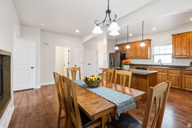 2029 West Crescent Row Mapleton, UT 84664 - Photo 12 of 35 Wood-finish flooring throughout, with a tiled fireplace surround, white paneled doors, and recessed lighting
