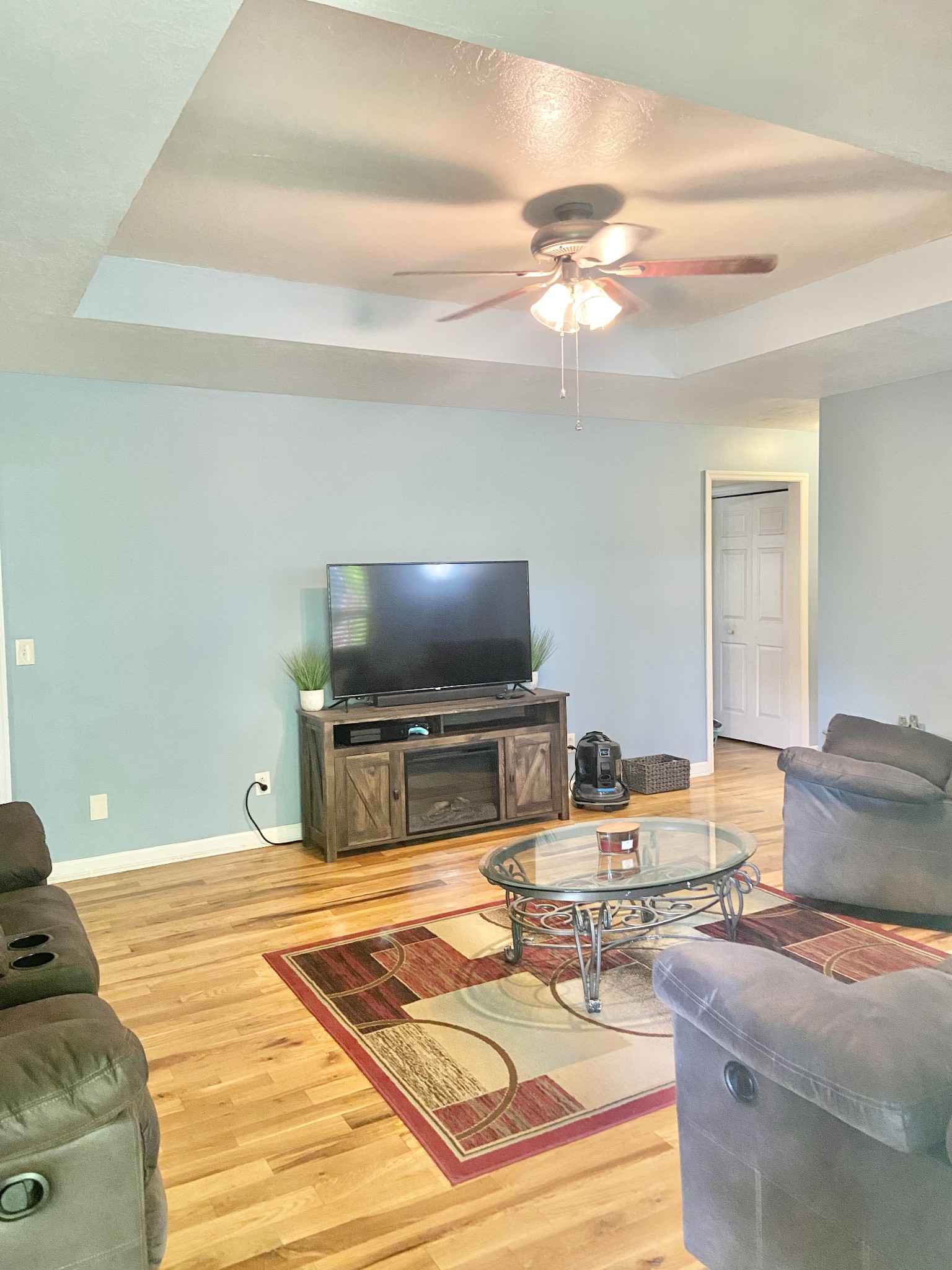 1050 West Point Road Lawrenceburg, TN 38464 - Photo 3 of 17 a bedroom with furniture and a flat screen tv