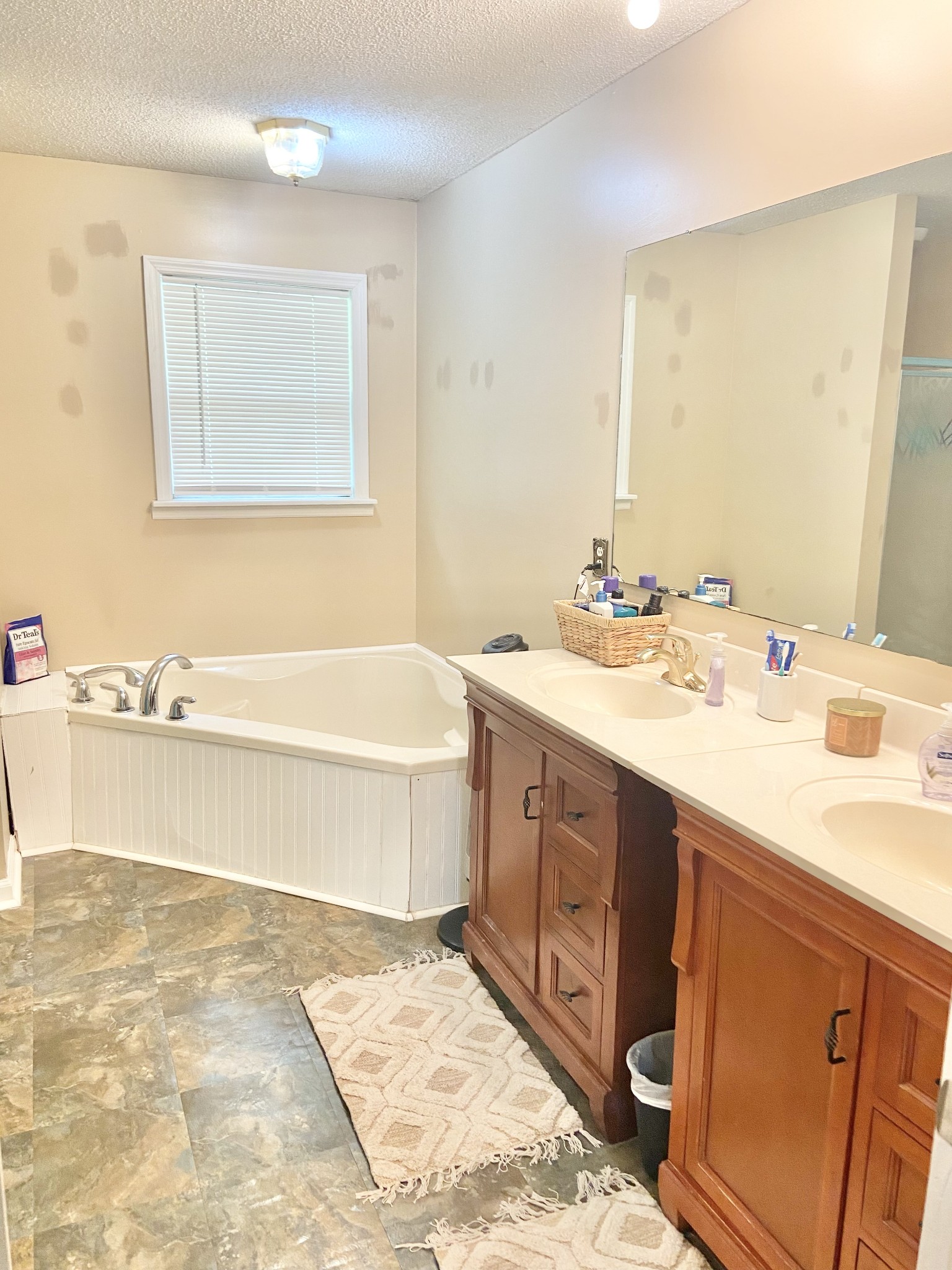 1050 West Point Road Lawrenceburg, TN 38464 - Photo 8 of 17 a spacious bathroom with a tub sink and mirror