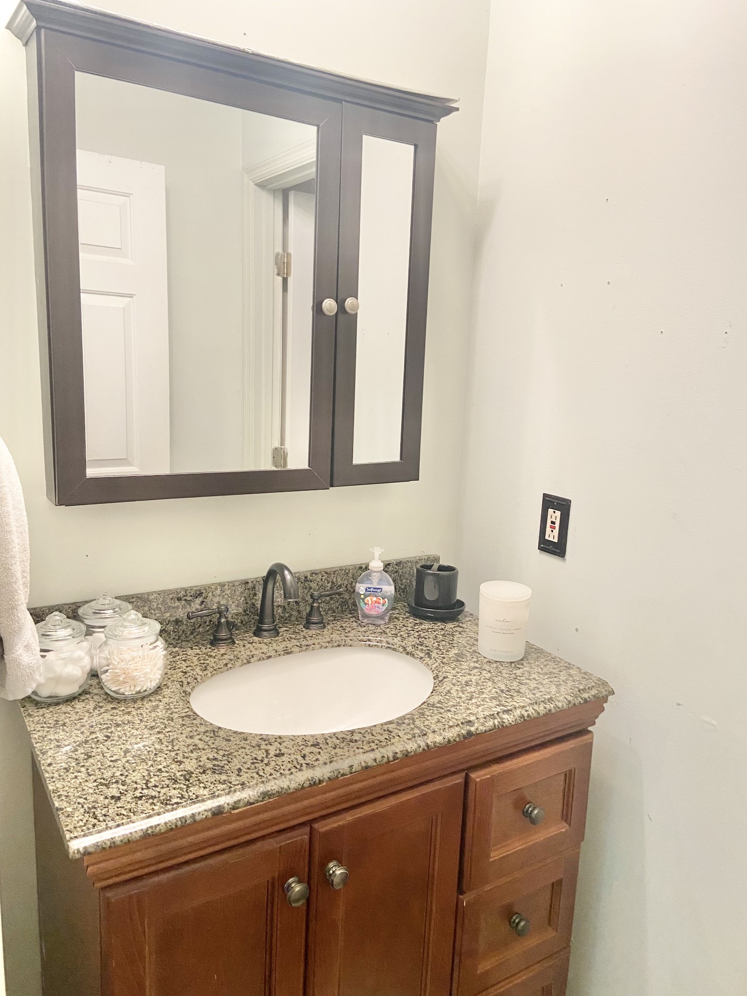1050 West Point Road Lawrenceburg, TN 38464 - Photo 10 of 17 a bathroom with a granite countertop sink and a mirror