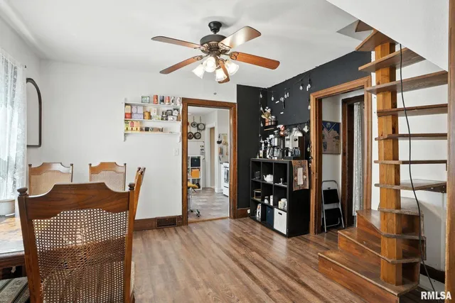 a view of a dining room with furniture and wooden floor