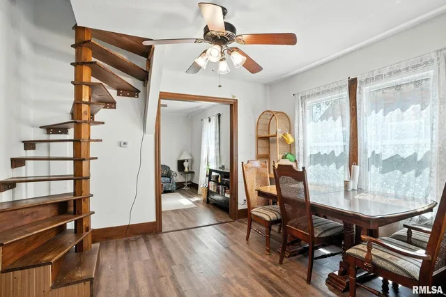 a view of a livingroom with furniture and hardwood floor