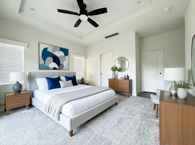 a large white kitchen with wooden floors stainless steel appliances