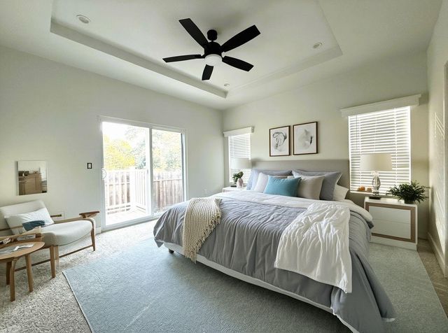a kitchen with a sink a counter top space stainless steel appliances cabinets and a large window