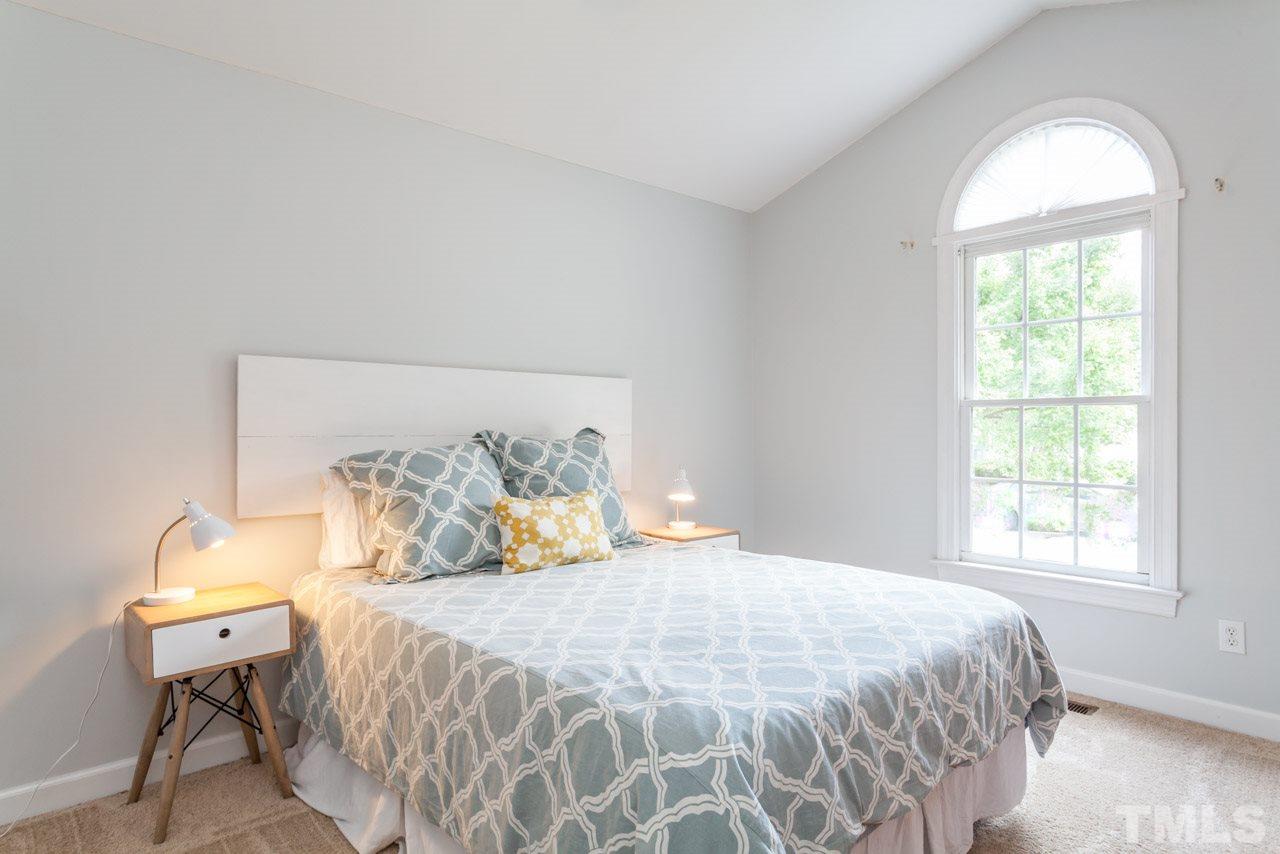 4405 Bartholomew Circle Raleigh, NC 27604 - Photo 14 of 22 a bedroom with a bed and a window