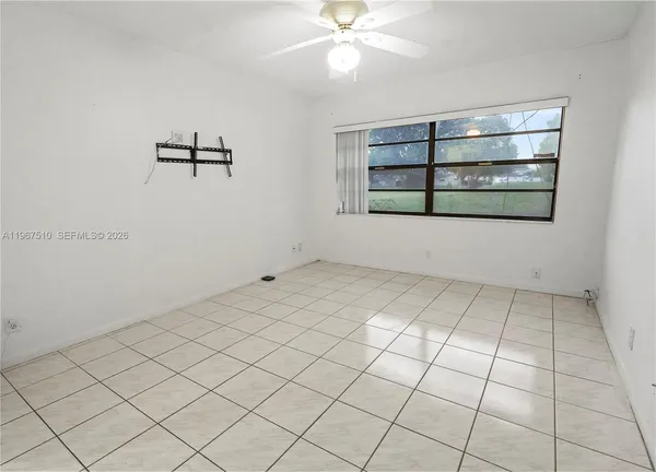 a view of an empty room and window