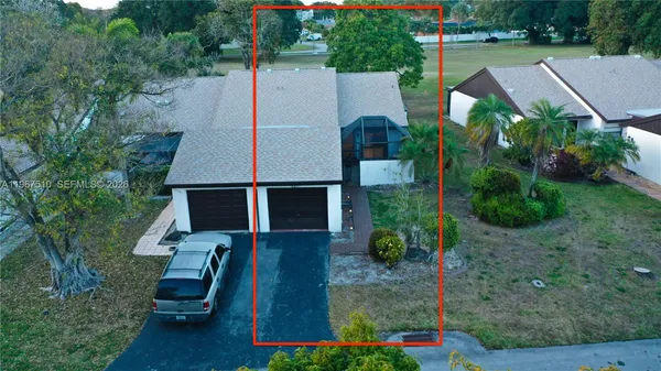 an aerial view of house with yard