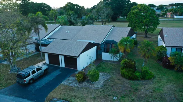 an aerial view of a house having yard