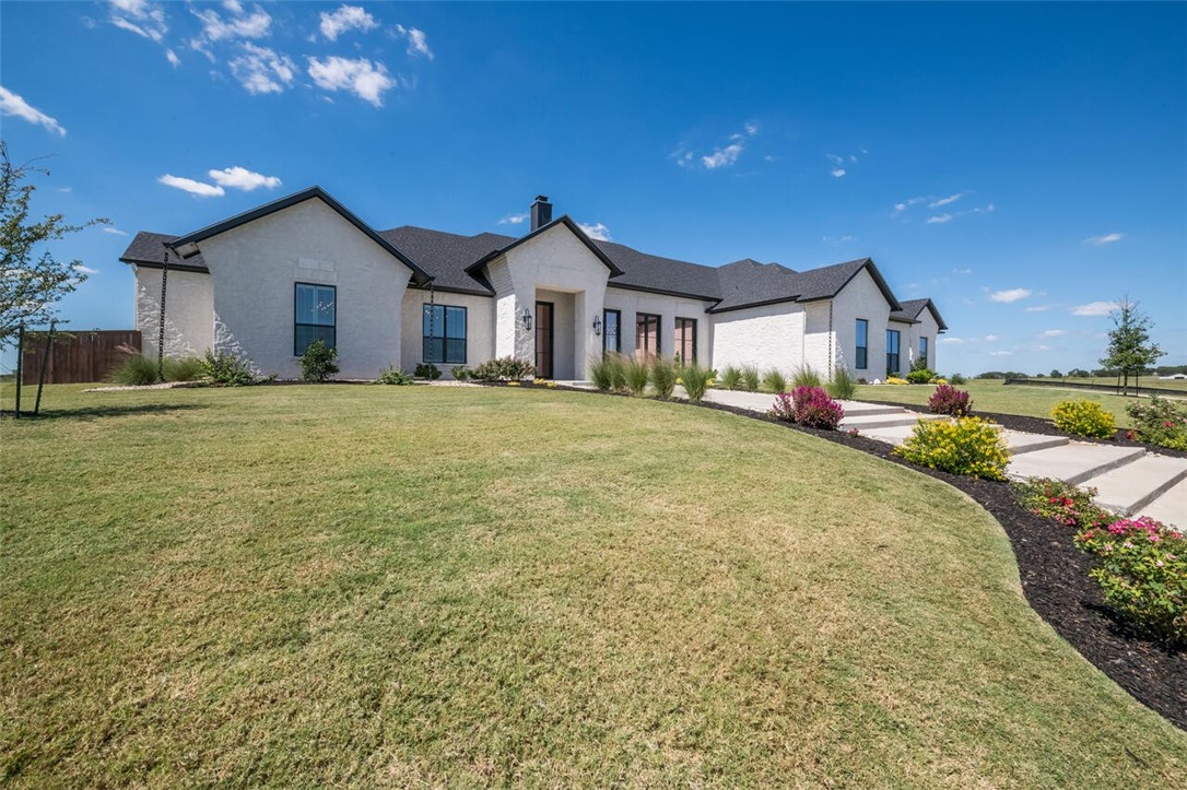 134 Sunflower Street Lorena, TX 76655 - Photo 15 of 86 a front view of a house with a yard