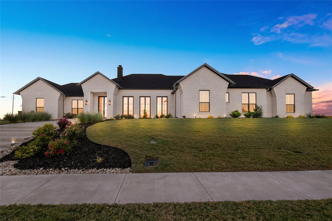 134 Sunflower Street Lorena, TX 76655 - Photo 2 of 86 a front view of a house with a garden