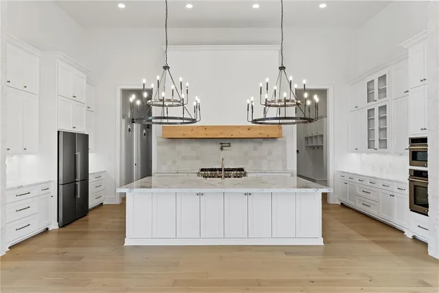 a bathroom with a double vanity sink mirror and shower