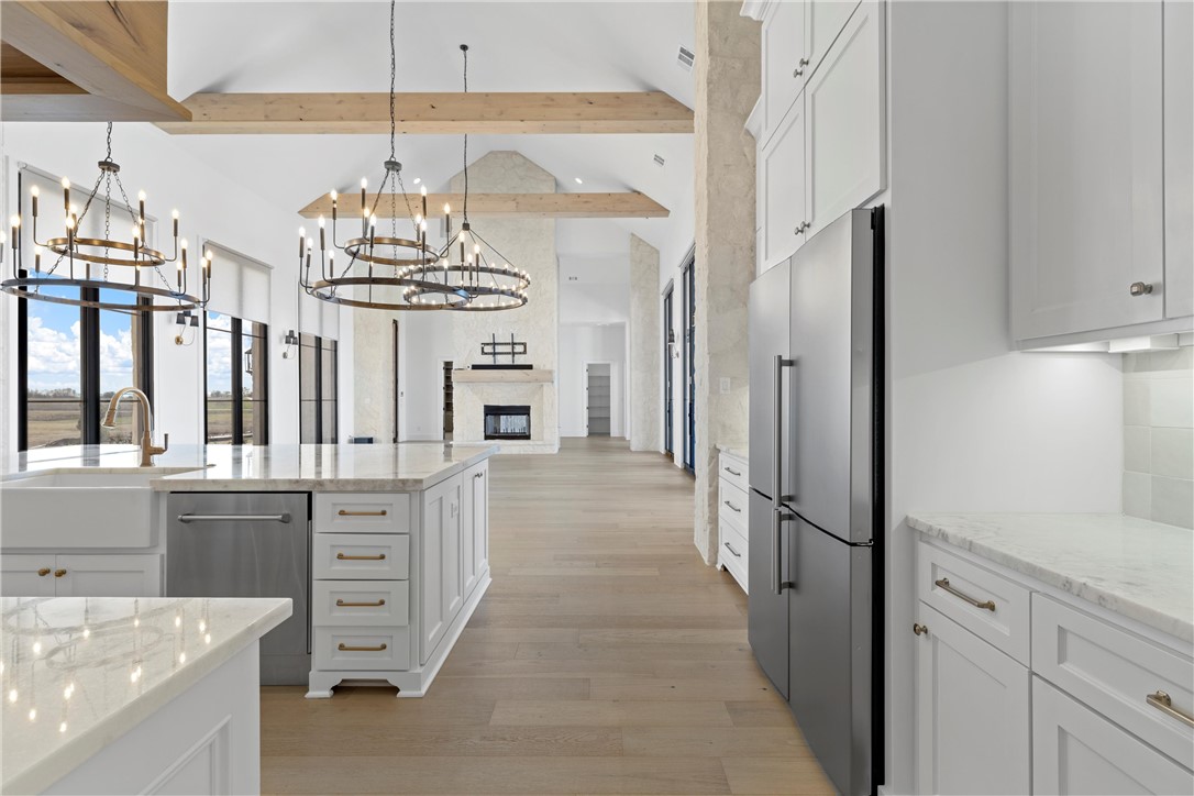 134 Sunflower Street Lorena, TX 76655 - Photo 28 of 86 a very nice looking kitchen with a chandelier