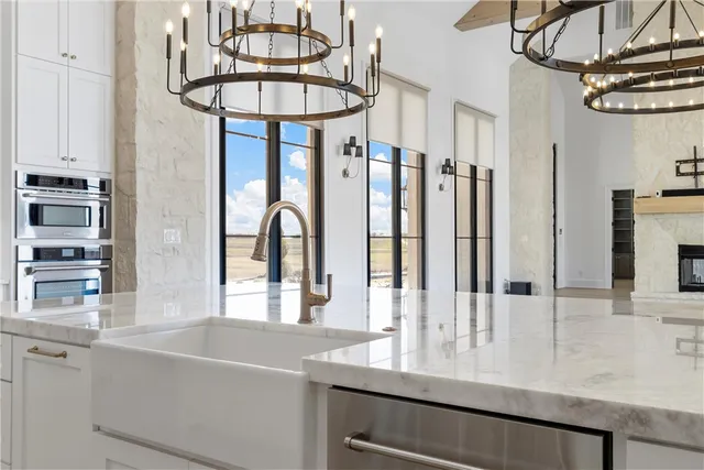 a bathroom with a double vanity sink mirror and shower