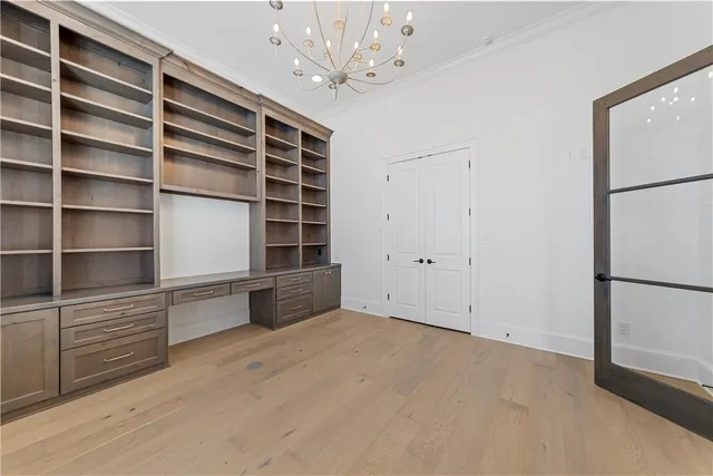 a bathroom with a granite countertop sink vanity mirror and toilet