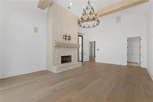 a kitchen with kitchen island a sink and living room view