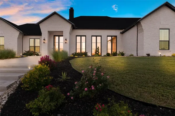 a view of a house with a garden