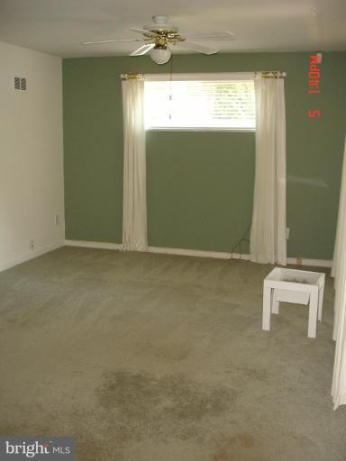 12910 Bluhill Road Silver Spring, MD 20906 - Photo 4 of 10 a view of an empty room with a window