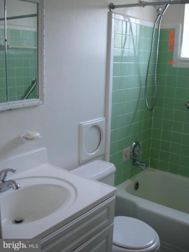 12910 Bluhill Road Silver Spring, MD 20906 - Photo 8 of 10 a bathroom with a sink and bathtub