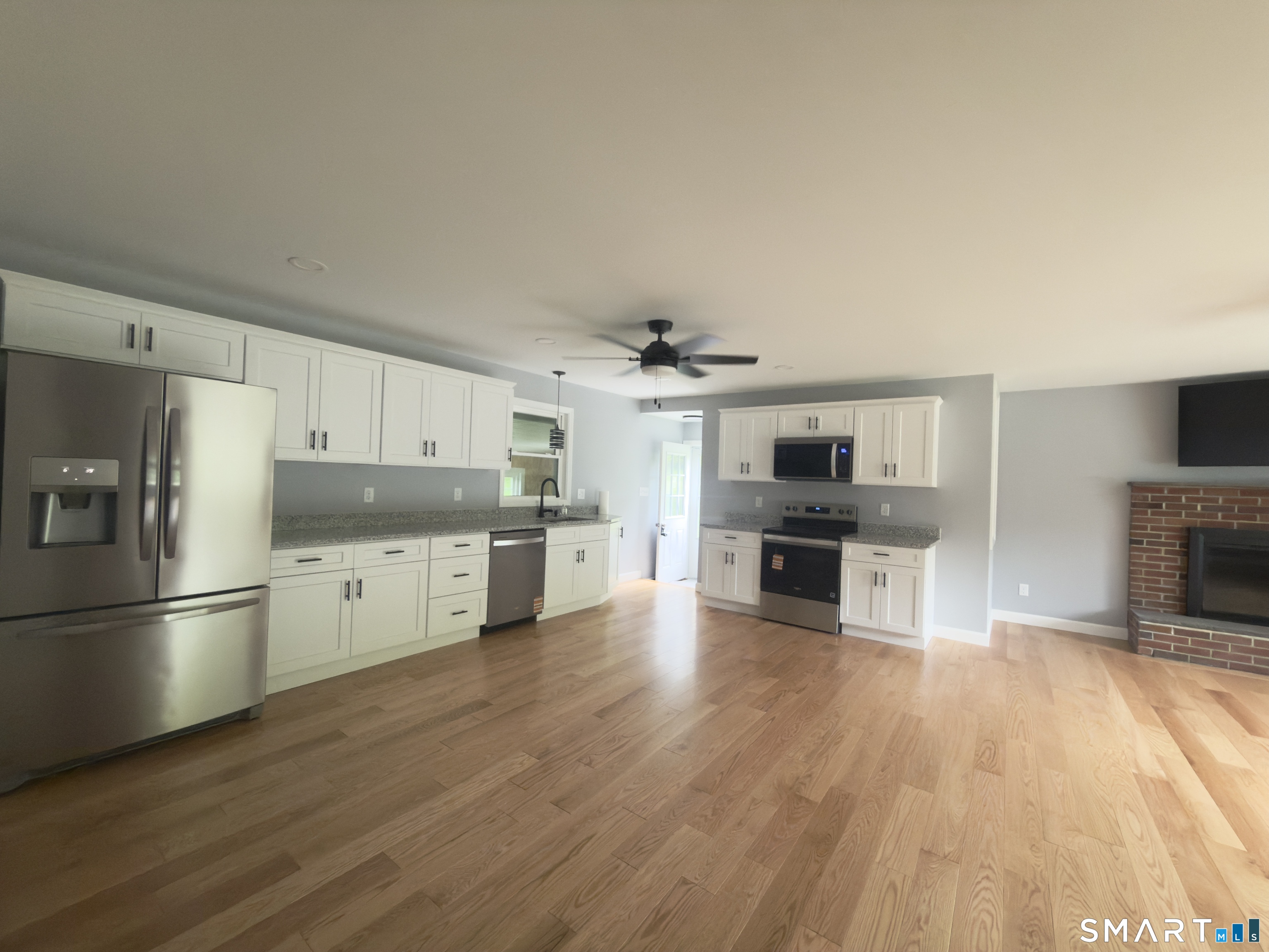 44 Polly Avenue Killingly, CT 06239 - Photo 10 of 22 a kitchen with stainless steel appliances a refrigerator and a stove top oven