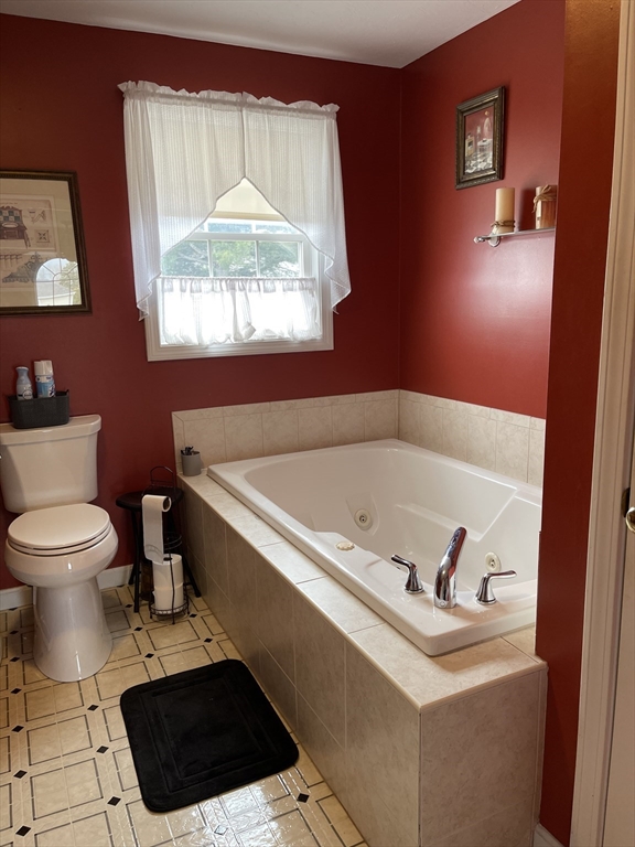 515 Kennedy Street Fall River, MA 02721 - Photo 15 of 34 a bathroom with a toilet a sink and a window