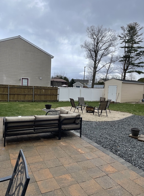 515 Kennedy Street Fall River, MA 02721 - Photo 30 of 34 a view of a terrace with couches and a fire pit