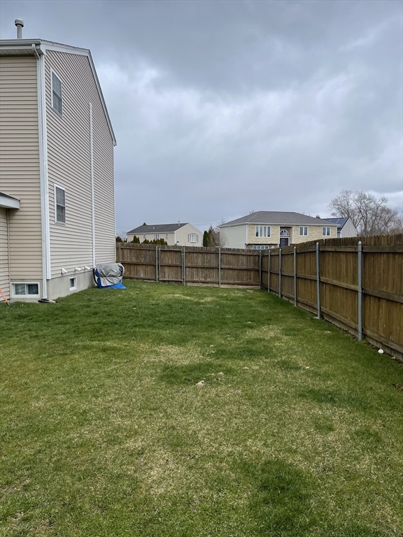 515 Kennedy Street Fall River, MA 02721 - Photo 34 of 34 a view of a garden with a building in the background