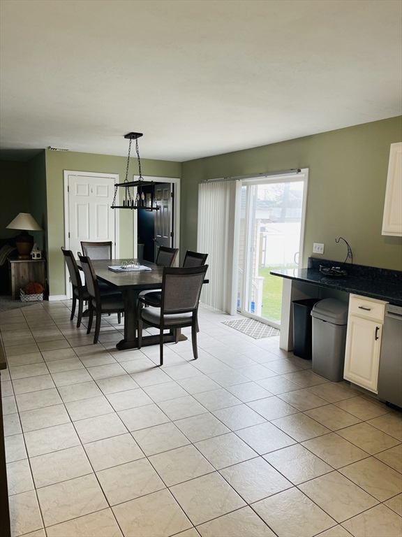 515 Kennedy Street Fall River, MA 02721 - Photo 6 of 34 a view of a kitchen with dining area a sink and wooden floor