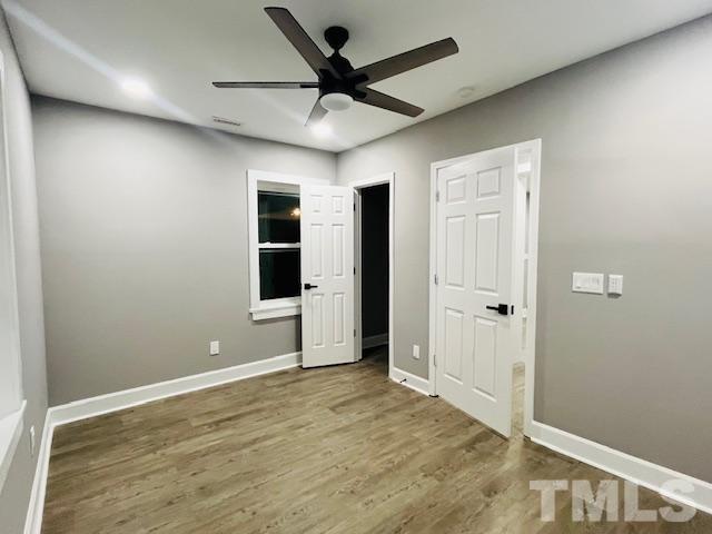 8781 Mill Branch Road Rocky Mount, NC 27803 - Photo 13 of 19 wooden floor in an empty room